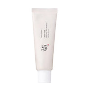 A tube of 'Beauty of Joseon Relief Sun' sunscreen with SPF50+ PA++++ protection, featuring rice and grain fermented extracts. The packaging is in a light beige tone with Korean text and a heart symbol.
